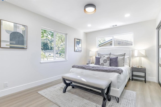 bedroom with light hardwood / wood-style flooring