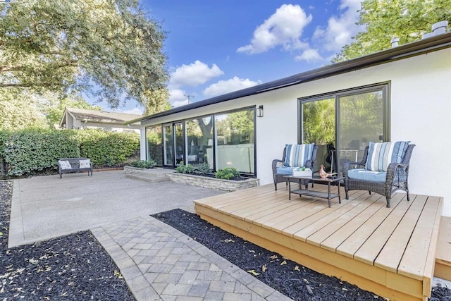 exterior space with an outdoor hangout area and a patio