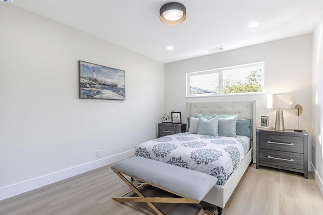 bedroom with light hardwood / wood-style floors