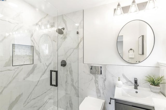 bathroom featuring vanity, decorative backsplash, and a shower with door