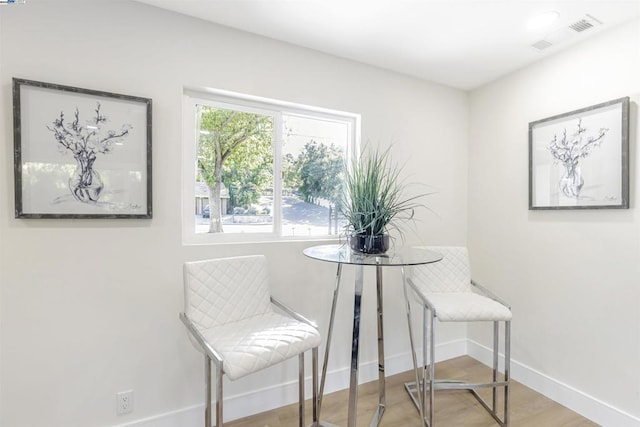 sitting room with light hardwood / wood-style flooring