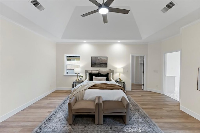 6054 N Woodson Ave, Fresno, CA 93711 - bedroom with a tray ceiling, light wood-style flooring, and visible vents