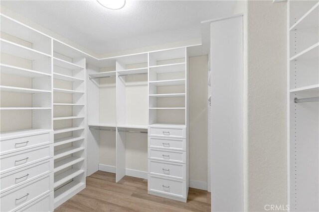 6054 N Woodson Ave, Fresno, CA 93711 - spacious closet with light wood-type flooring
