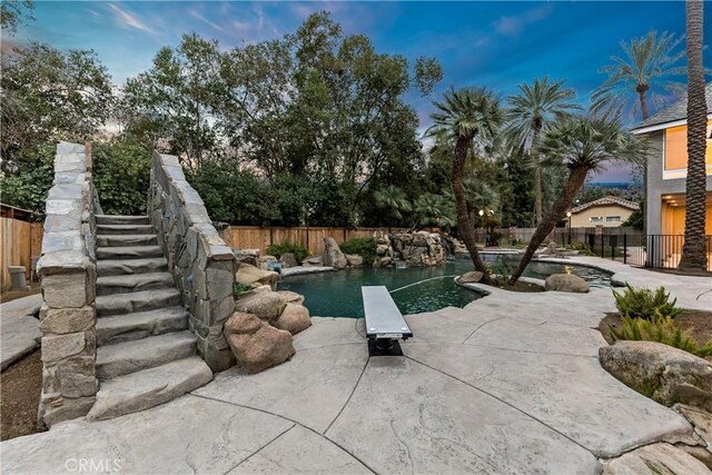 6054 N Woodson Ave, Fresno, CA 93711 - view of pool with a patio area, a fenced in pool, and a fenced backyard