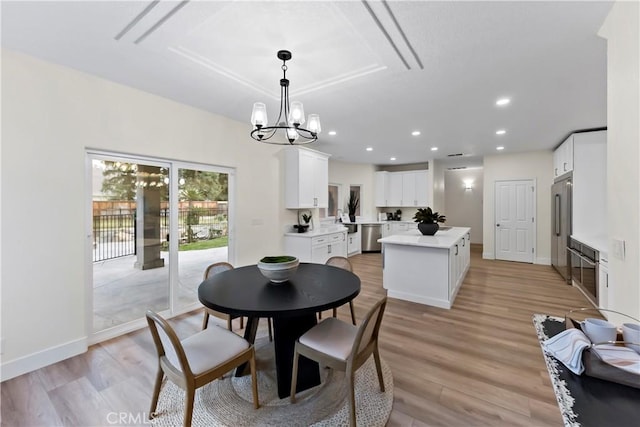 6054 N Woodson Ave, Fresno, CA 93711 - dining area with recessed lighting, baseboards, a chandelier, and light wood finished floors