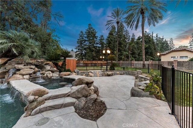 6054 N Woodson Ave, Fresno, CA 93711 - view of swimming pool featuring a patio and a fenced backyard