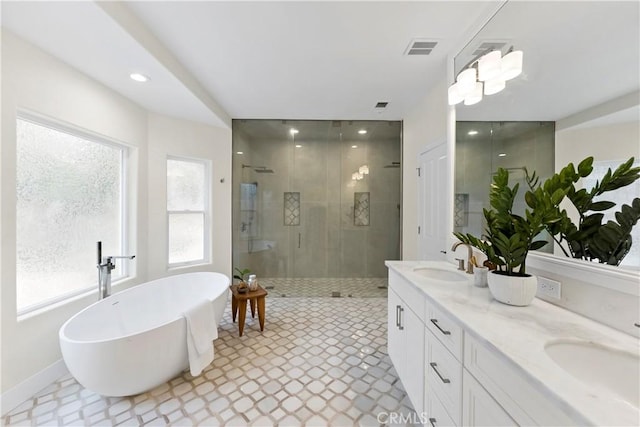 6054 N Woodson Ave, Fresno, CA 93711 - bathroom with a sink, a freestanding tub, a stall shower, and double vanity