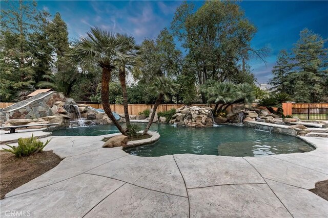 6054 N Woodson Ave, Fresno, CA 93711 - view of swimming pool featuring a fenced in pool and a fenced backyard
