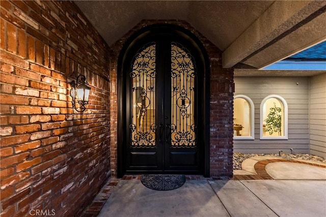 6054 N Woodson Ave, Fresno, CA 93711 - view of exterior entry with french doors and brick siding