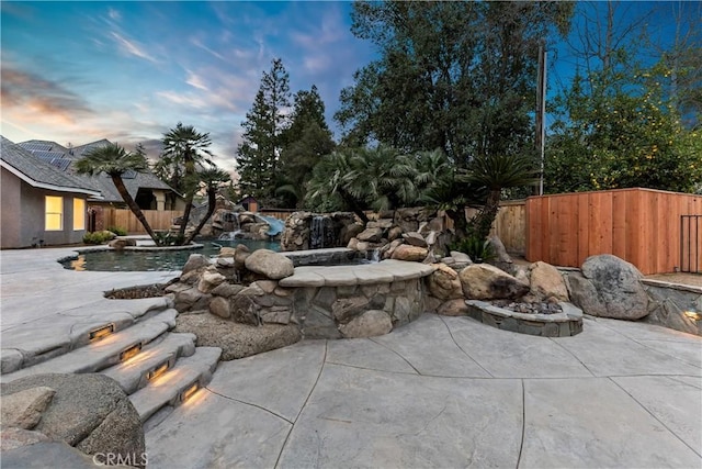 6054 N Woodson Ave, Fresno, CA 93711 - view of patio with a fenced in pool, an outdoor fire pit, and a fenced backyard