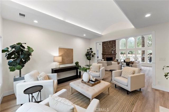 6054 N Woodson Ave, Fresno, CA 93711 - living area featuring recessed lighting, light wood-type flooring, baseboards, and a fireplace