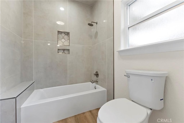 6054 N Woodson Ave, Fresno, CA 93711 - bathroom featuring toilet,  shower combination, and wood finished floors