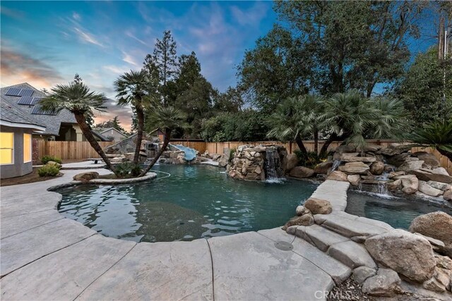 6054 N Woodson Ave, Fresno, CA 93711 - view of swimming pool featuring a patio area, a fenced backyard, and a fenced in pool