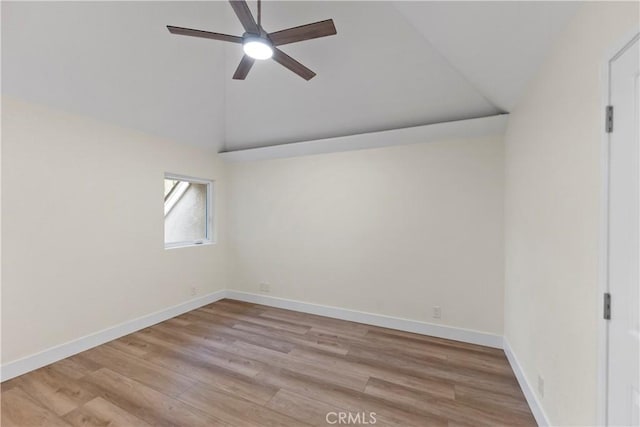 6054 N Woodson Ave, Fresno, CA 93711 - spare room with ceiling fan, baseboards, lofted ceiling, and wood finished floors