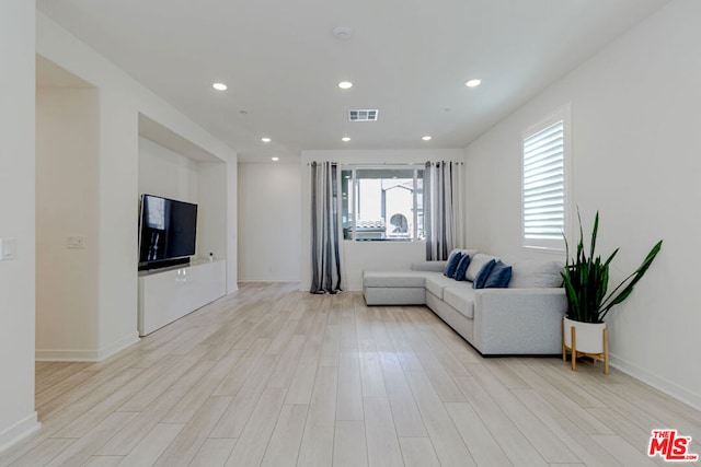 living room with light hardwood / wood-style floors