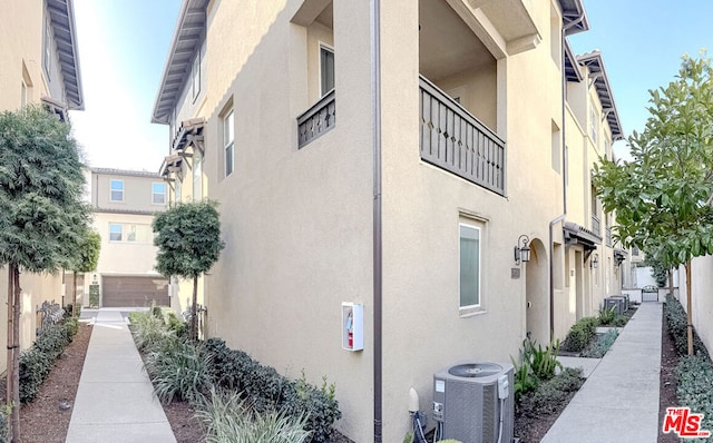 view of property exterior with cooling unit