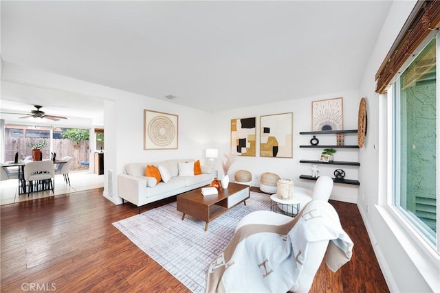 living room with wood finished floors and baseboards