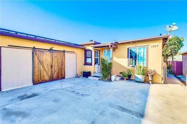 single story home featuring a patio area