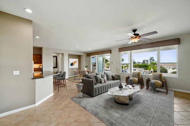 living room with light tile patterned floors and ceiling fan