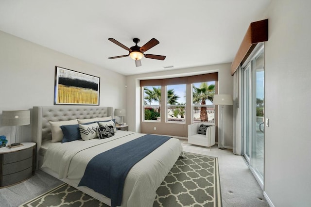 carpeted bedroom with ceiling fan and access to outside