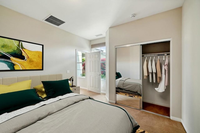 bedroom featuring light carpet and a closet