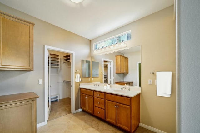 bathroom with tile patterned flooring and vanity