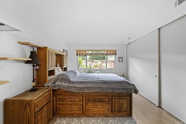 bedroom with light hardwood / wood-style floors