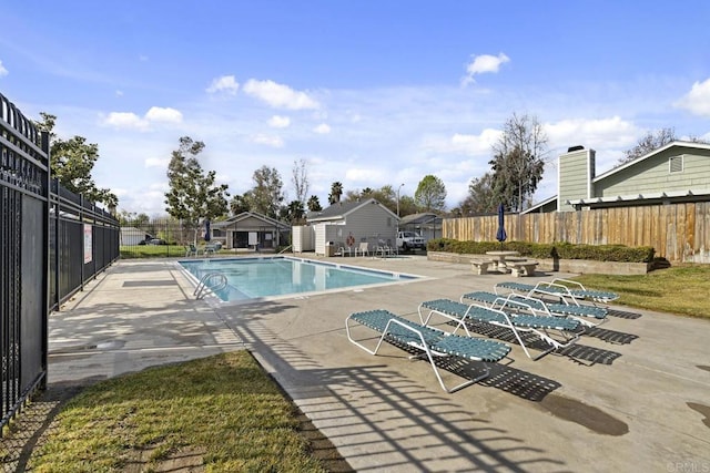 view of swimming pool with a patio area