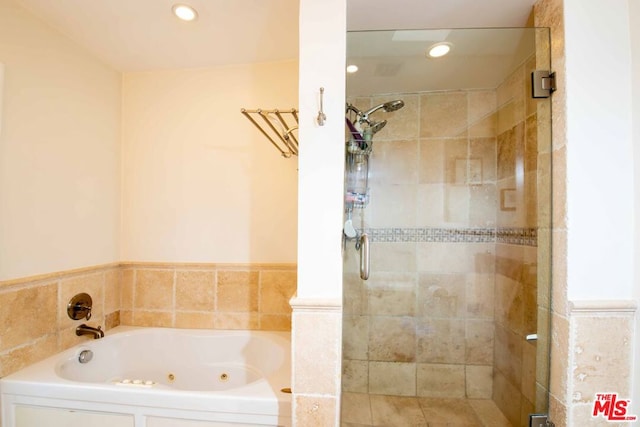 bathroom featuring plus walk in shower