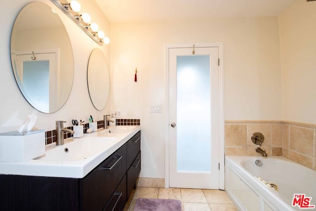 bathroom with a tub to relax in and vanity