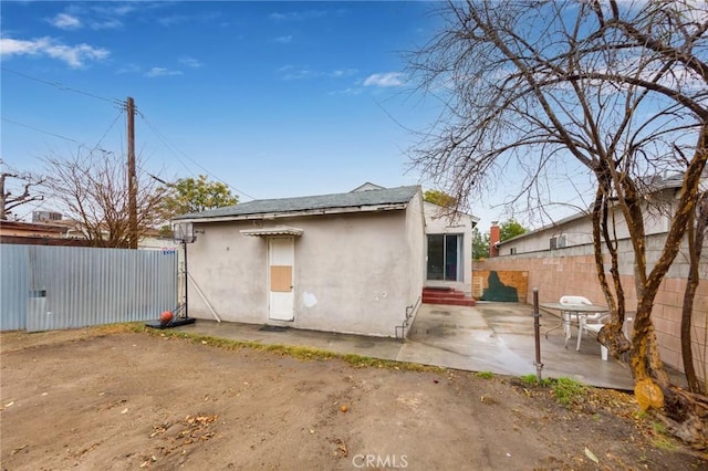 rear view of property with a patio area