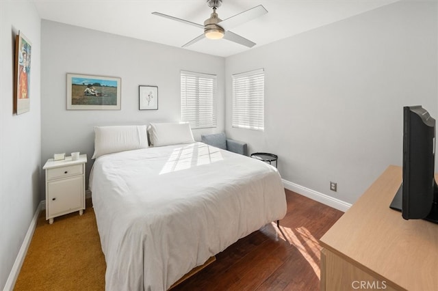 bedroom featuring dark wood-type flooring and ceiling fan