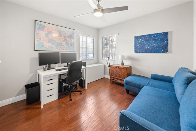 office with dark hardwood / wood-style flooring and ceiling fan