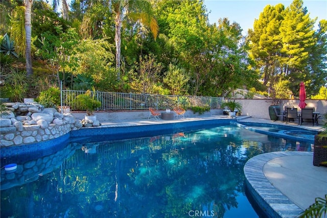 view of swimming pool featuring a patio area