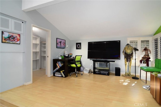 living room with lofted ceiling and light hardwood / wood-style flooring