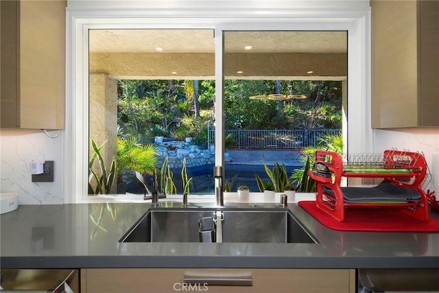 kitchen with sink and decorative backsplash