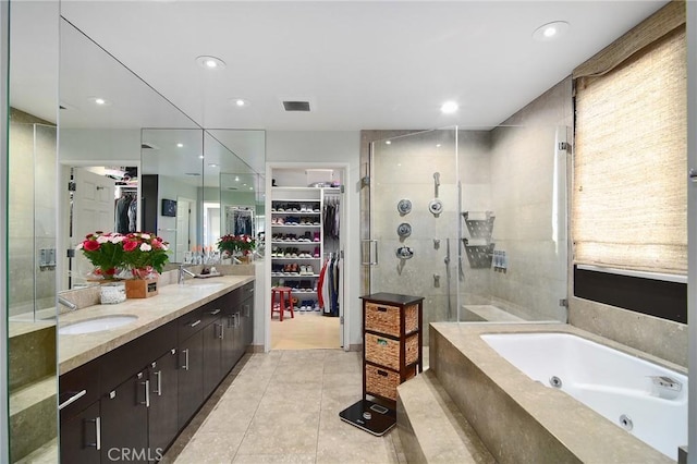 bathroom featuring vanity, tile patterned floors, and shower with separate bathtub