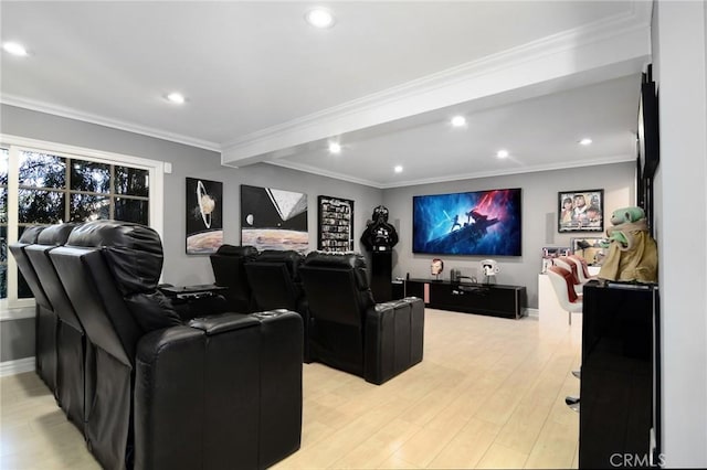 home theater featuring crown molding, beam ceiling, and light wood-type flooring