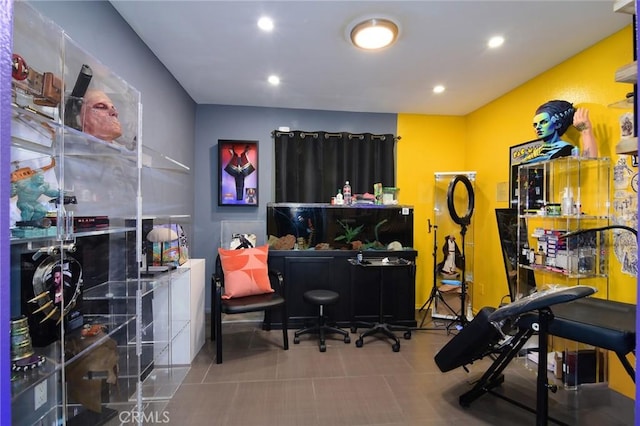 exercise room with tile patterned floors