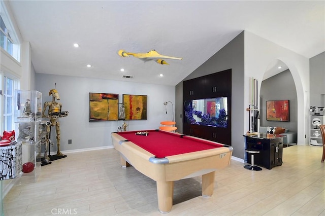 game room with pool table, light hardwood / wood-style floors, and vaulted ceiling