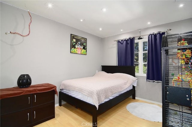 bedroom with light wood-type flooring