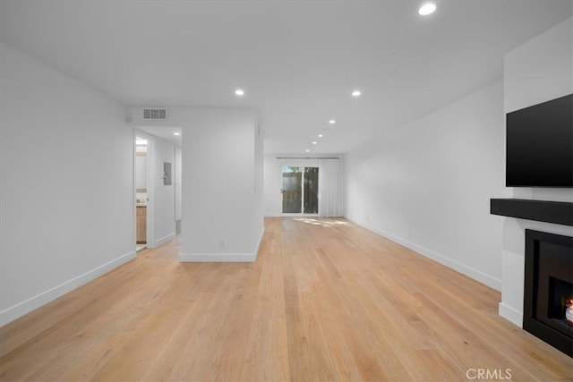 unfurnished living room with light hardwood / wood-style flooring