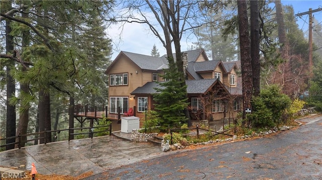 view of front of property featuring a wooden deck