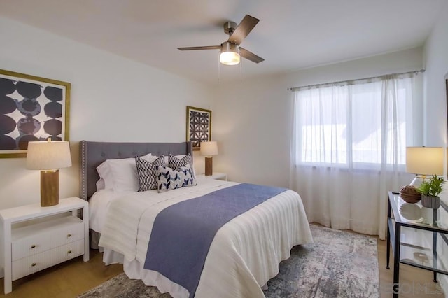 bedroom featuring ceiling fan and light wood-type flooring