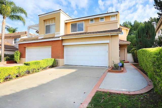 view of front of home featuring a garage and a pergola