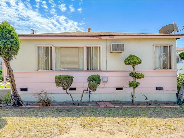 view of home's exterior with a lawn