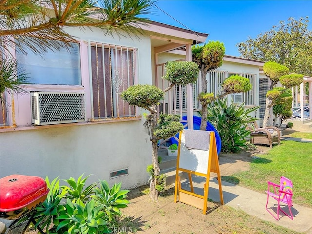 view of property exterior with cooling unit