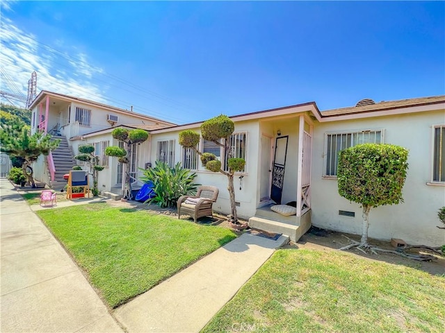 view of front of home with a front lawn