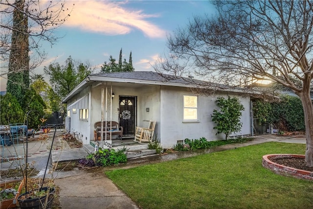 view of front of property with a yard