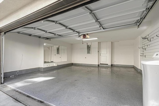 garage featuring a garage door opener and electric panel